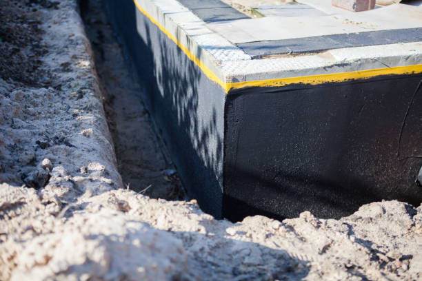 Professional Waterproofing technician working in Newfane, NY